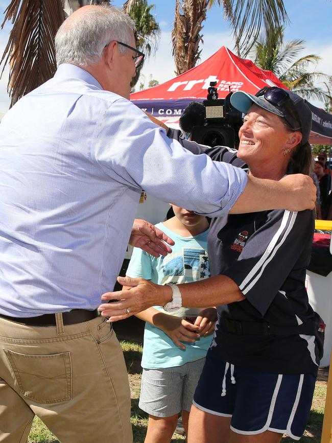 Scott Morrison meets local resident Kat Deadman as he visits cyclone affected areas in the tourist town of Kalbarri. Picture: Getty