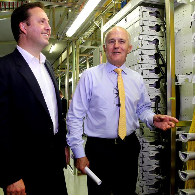 A then-Communications Minister Malcolm Turnbull tours a Gold Coast Telstra Exchange with former MP Steven Ciobo, showing the inside of the buildings is about as much fun to look at as the outside. Picture: Tim Marsden