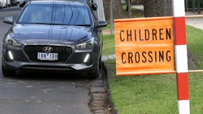 Lauriston Girls and Stonnington Council battling over the location of a school crossing on Mercer Rd. Sschool wants to build a drop-off/pick-up area in grounds but needs permission to move the crossing, council and engineers won't approve it. Please get pics of general busy picking up/dropping off shenanigans, people using the crossing. Illegally parked cars less than 20m from school crossing ....Picture Norm Oorloff