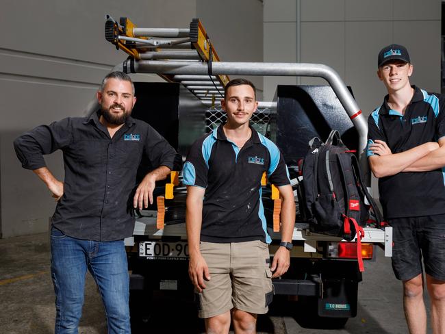 Electrician Simon Reed, who owns Insight Electrical and Communications, with apprentices Logan Smith and James at a job site in Penrith. Picture: Max Mason-Hubers