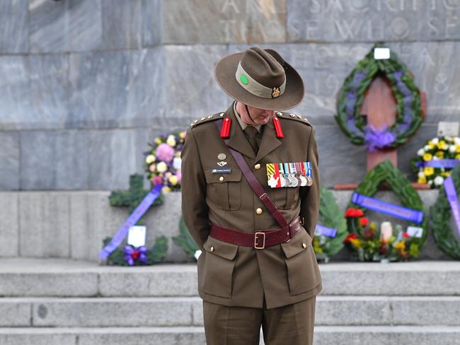 Lieutenant Colonel Graham Malcolm Goodwin bows his head during this morning’s Dawn Service in Adelaide. Photo: AAP Image/David Mariuz.