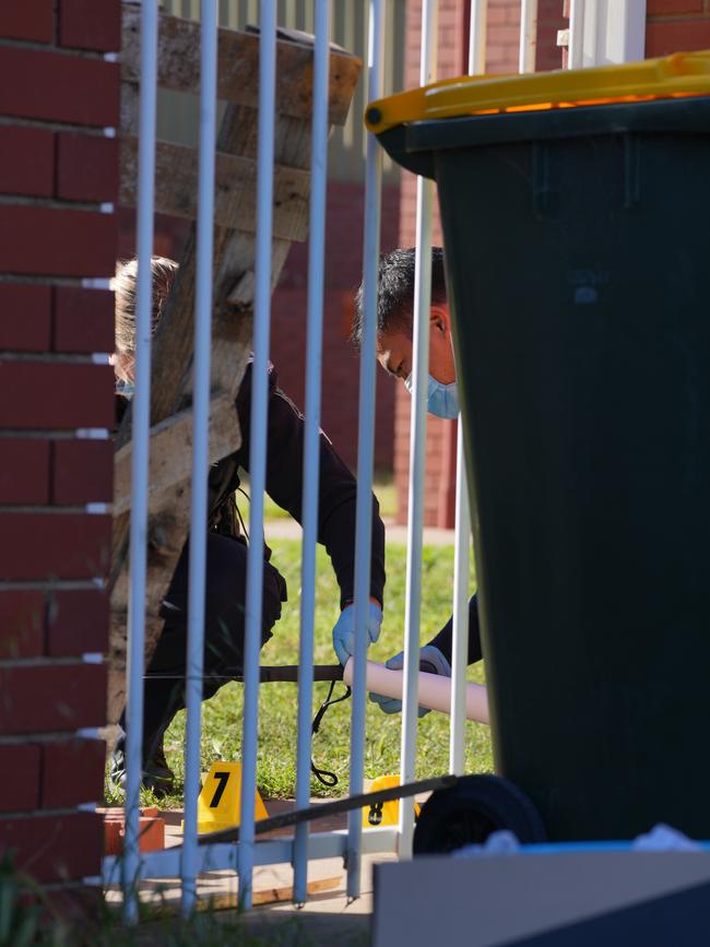 Police gather evidence on Wednesday. Picture Dean Martin