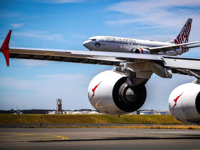 Qantas and Virgin Australia planes at Kingsford Smith International airport on November 15, 2019 in Sydney, Australia.