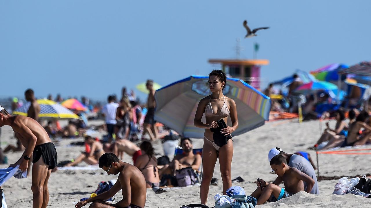 ICU beds are running out in states like Florida (above) which relaxed restrictions early. Picture: Chandan Khanna/AFP