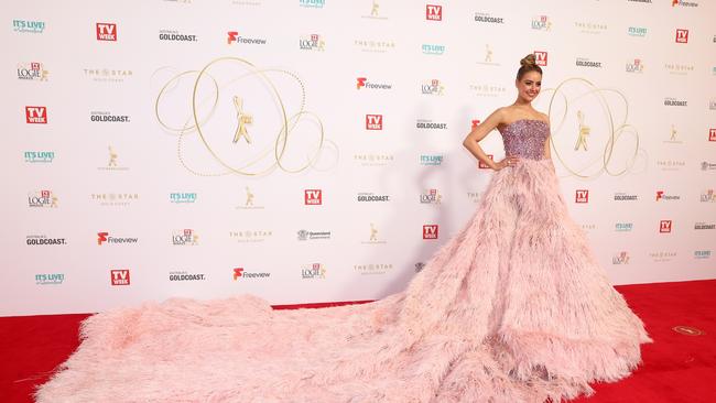 April Rose Pengilly shed pink feathers as she walked the red carpet. Picture: Getty Images