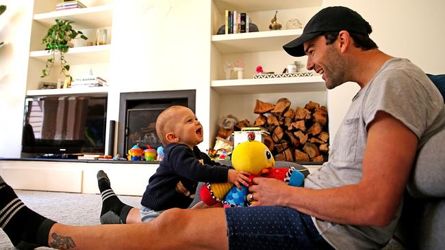 Jordan Lewis at home with his one-year-old son Freddie. Picture: Tim Carrafa