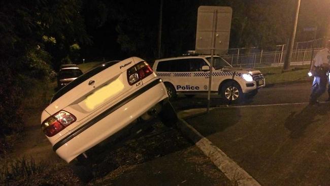 No one was injured when a car took a wrong turn off Ballina Rd at Lismore Heights on Wednesday and ended up perched precariously on an almost vertical slope. Photo: Rodney Stevens. Picture: Photo: Rodney Stevens