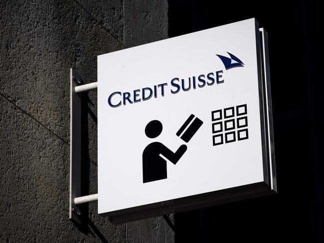 A sign of Credit Suisse bank is seen outside a branch in Geneva, on March 15, 2023. - Credit Suisse shares nosedived on on March 15, 2023, after its main shareholder said it would not provide more funding, with reassuring comments from the Swiss bank's chairman unable to calm the market panic. (Photo by Fabrice COFFRINI / AFP)