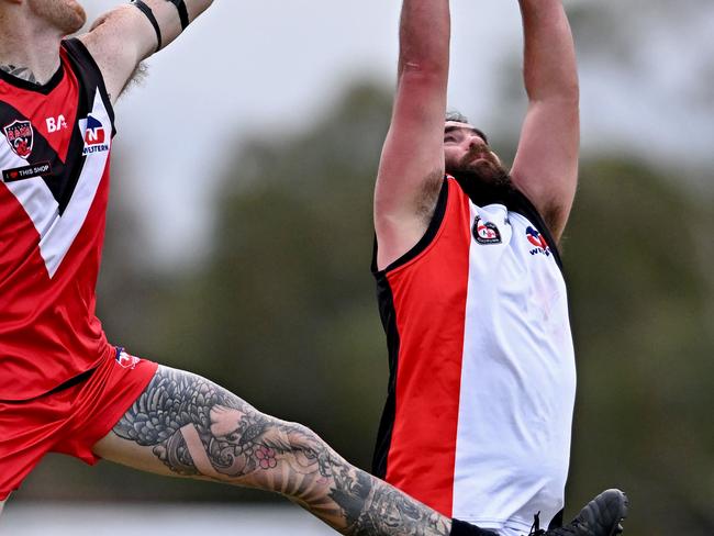 Western RamsÃ  Ryan Tyson  and North SunshineÃs Ray Khan during the WFNL Western Rams v North Sunshine football match in Rockbank, Saturday, June 22, 2024. Picture: Andy Brownbill