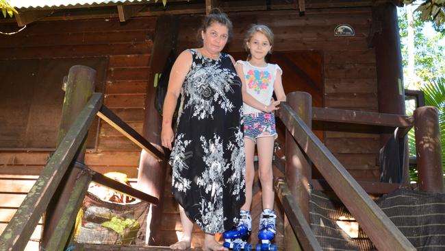 Annalisa Buchanan, pictured with daughter Zoe, 10, has lived in a run down villa at Kuranda Resort since August, while she seeks public housing. The villa has no hot water. Picture: Bronwyn Farr