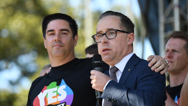 Partners in success: Qantas boss Alan Joyce celebrates the Yes victory with his partner. Picture: AAP