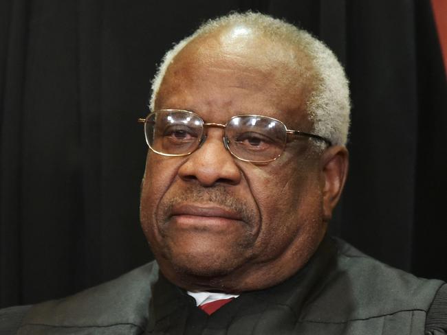 (FILES) In this file photo taken on November 30, 2018 Associate Justice Clarence Thomas poses for the official group photo at the US Supreme Court in Washington, DC. - The Supreme Court announced in a statement that Justice Clarence Thomas was hospitalized Friday night, March 18, with an infection. (Photo by MANDEL NGAN / AFP)