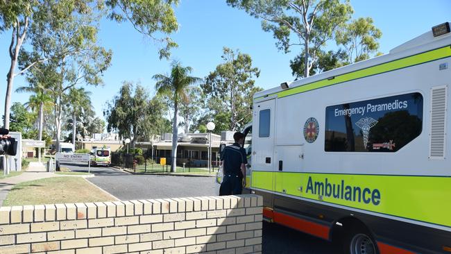 Ambulances queue outside the North Rockhampton Nursing Centre to transfer patients.