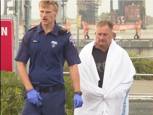 A paramedic takes Mr Curmi ashore following the incident. Picture: TNV