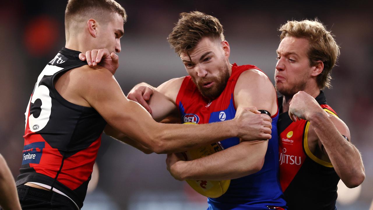 Jack Viney is tackled by Darcy Parish and Matt Guelfi. Picture: Michael Klein