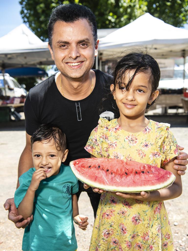 Avishek Khanal with son Amish and daughter Avika Khanal pick up juicy watermelon from the Toowoomba Farmers Markets.