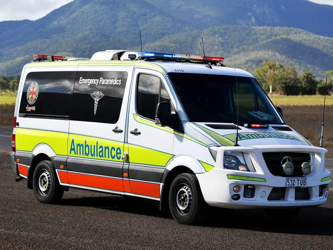 Emergency services attend a fatal car crash on the Bruce Highway, south of Townsville at Mount Surround. Garbage truck driver being looked over by paramedics.  Picture: Alix Sweeney