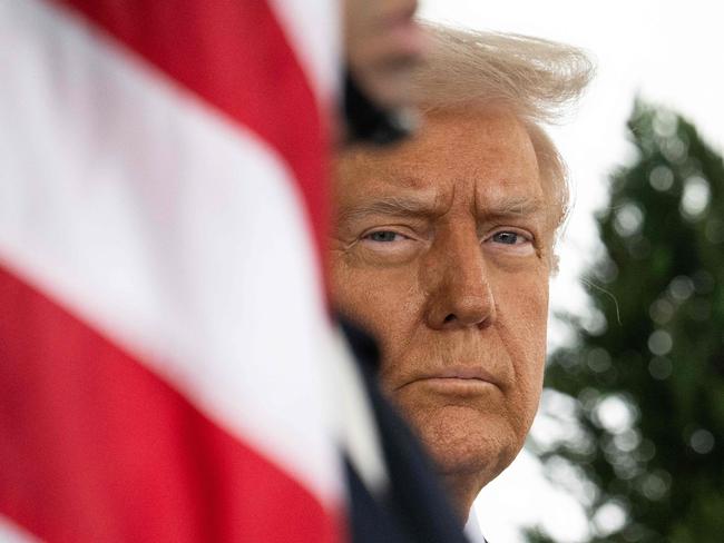 TOPSHOT - US President Donald Trump waits outside of the West Wing before welcoming King Abdullah II of Jordan to the White House in Washington, DC, on February 11, 2025. (Photo by Jim WATSON / AFP)