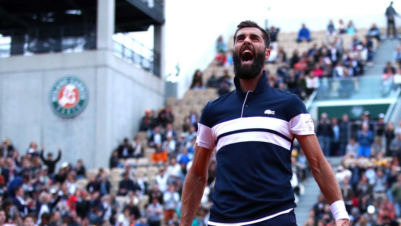 Benoit Paire celebrates victory during his mens singles second round match against Pierre-Hugues Herbert.