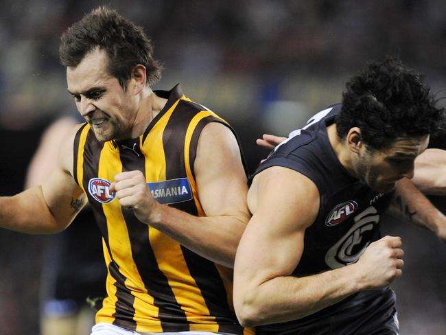 Luke Hodge and Brendan Fevola clash in 2008.