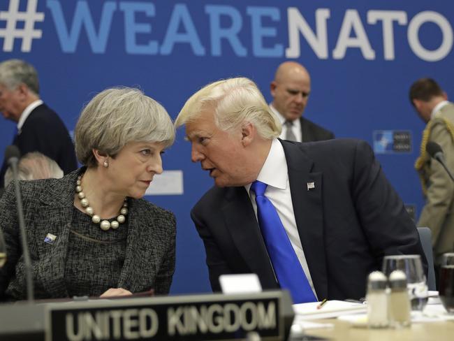 FILE -In this Thursday, May 25, 2017 file photo, British Prime Minister Theresa May, left, speaks to U.S. President Donald Trump during a NATO summit at NATO headquarters in Brussels. When Donald Trump walks into a NATO summit Wednesday, July 11, 2018,  international politics are bound to become intensely personal _ again. (AP Photo/Matt Dunham, Pool, File)
