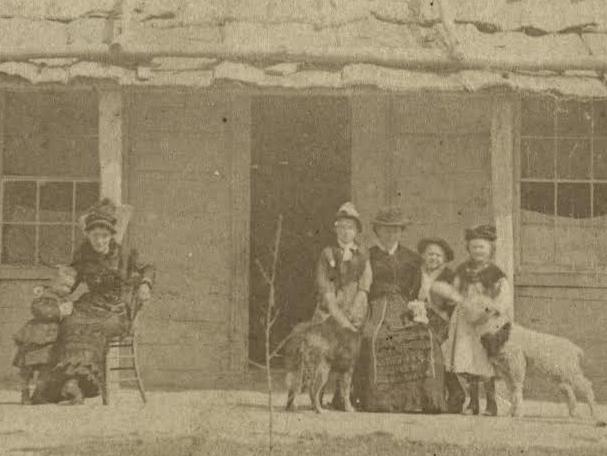 Kate Kelly looks after young Alice, left, in this picture with other members of the Kelly clan.