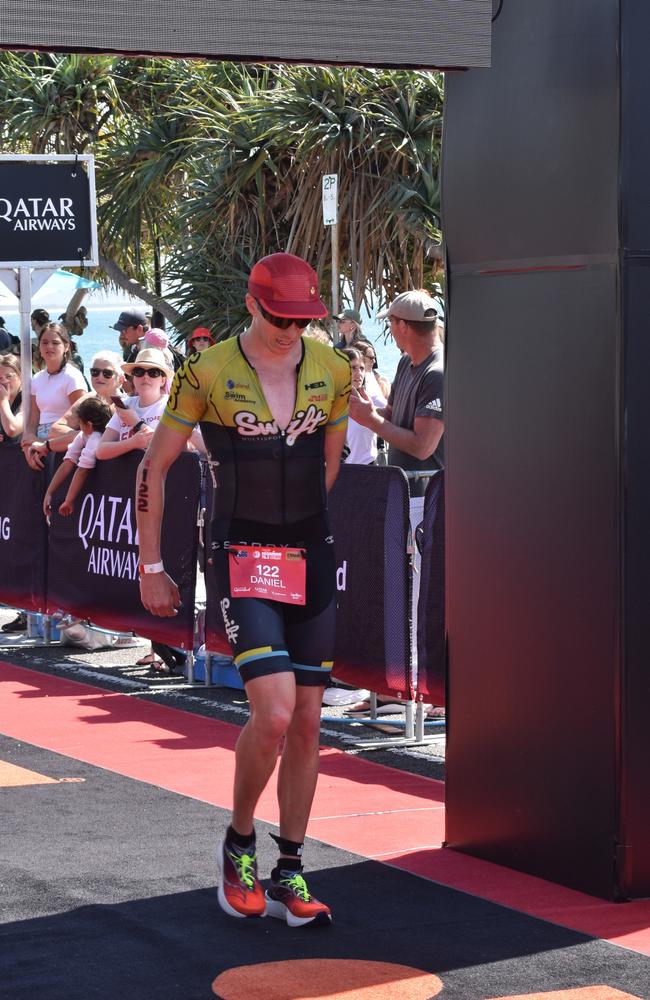 Athletes crossing the finish line at the Sunshine Coast Ironman 70.3 2023.