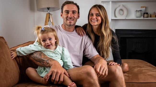 Port Adelaide star Jeremy Finlayson with fiancee Kellie Gardner and their daughter Sophia, 18 months, at their Hendon home. Picture: Tom Huntley