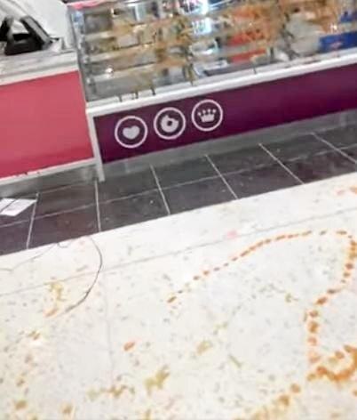 Shots from the video footage Jacinta Corbett took on her phone after vandals targeted Stockland's Donut King on Thursday night.