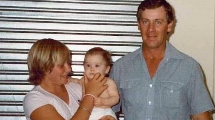 Ursula Barwick at the age of 11 holding her sister Kate, with father Peter in 1982.