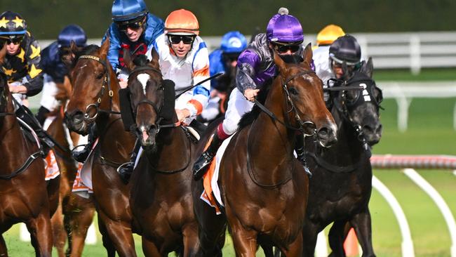 Griff collides with Veight before winning the Caulfield Guineas. Picture: Vince Caligiuri/Getty Images