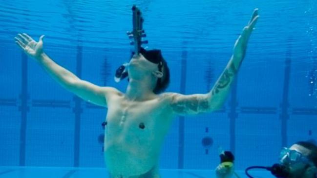 The Space Cowboy completed the most underwater somersaults while sword swallowing. Picture: Guinness World Record.