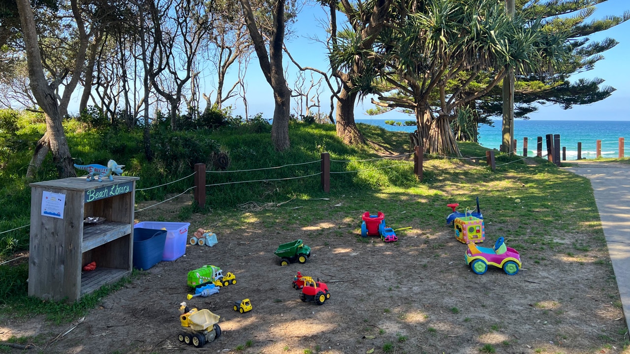 At Sawtell Beach, a new toy library had sprung up on the lawn in front of the surf club since our last visit, with a bunch of toys to take onto the sand. Picture: Celeste Mitchell.