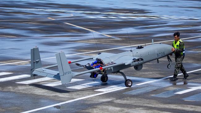 Taiwanese military personnel move an Albatross Tactical Unmanned Aircraft System during a live-fire drill on August 9.