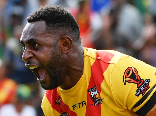 Papua New Guinea's Wellington Albert celebrates after scoring a try during their Rugby League World Cup match with Wales Dragons at the National Football Stadium in Port Moresby, Papua New Guinea, Saturday, October 28, 2017. (AAP Image/Mick Tsikas) NO ARCHIVING, EDITORIAL USE ONLY