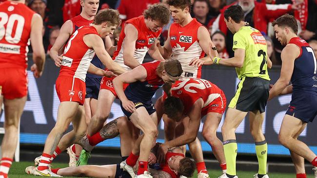 Sydney players remonstrate with James Harmes. Picture: Michael Klein