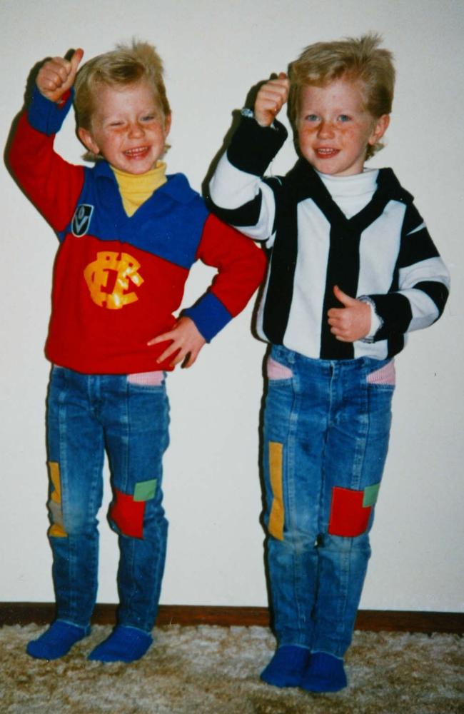 Troy at age 5 in Collingwood jumper pictured with twin brother Adam.