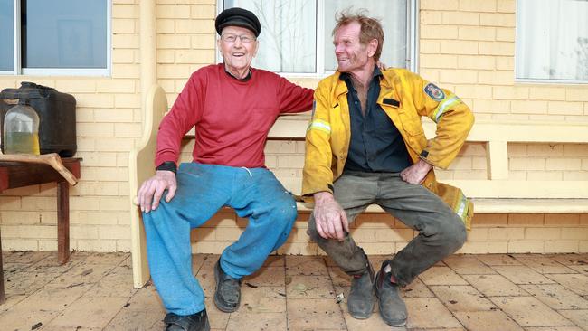 Volunteer firefighter Chris Saul left his fire truck and crew to stay behind with Karl Andersson and fight the fire at the remote mountain property. Picture: Gary Ramage