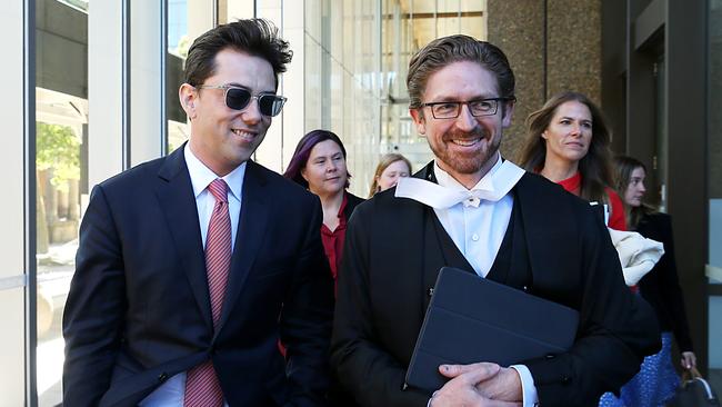 Journalist Joe Aston leaving Federal court with his lawyer in the defamation trial against Elaine Stead. Jane Dempster/The Australian.