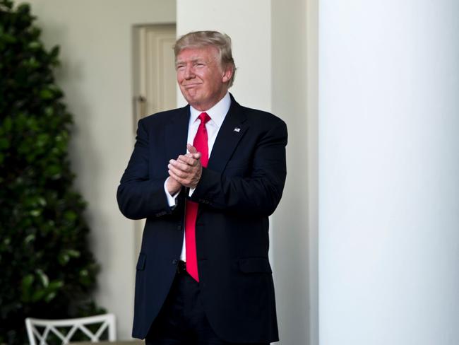 Mr Trump leaves after announcing the US will withdraw from the Paris accord in the Rose Garden of the White House. Picture: AFP/Brendan Smialowski