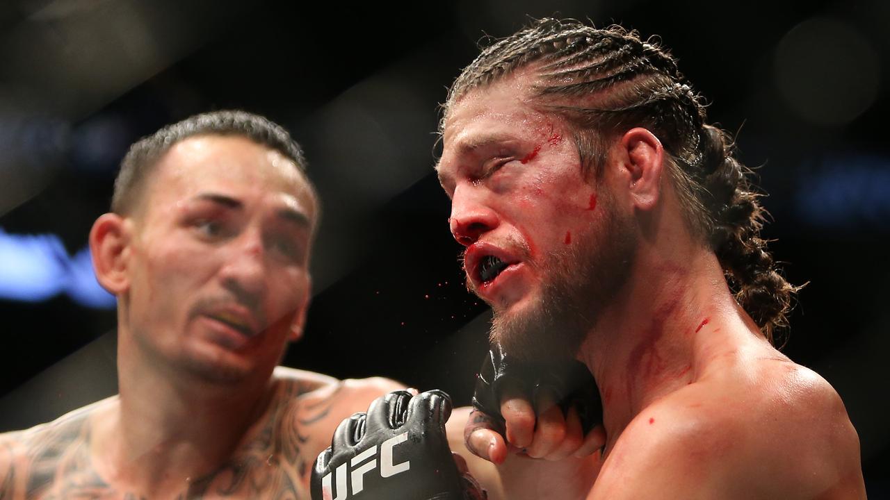 Max Holloway lands a left hand on Brian Ortega. Picture: Vaughn Ridley/Getty Images/AFP