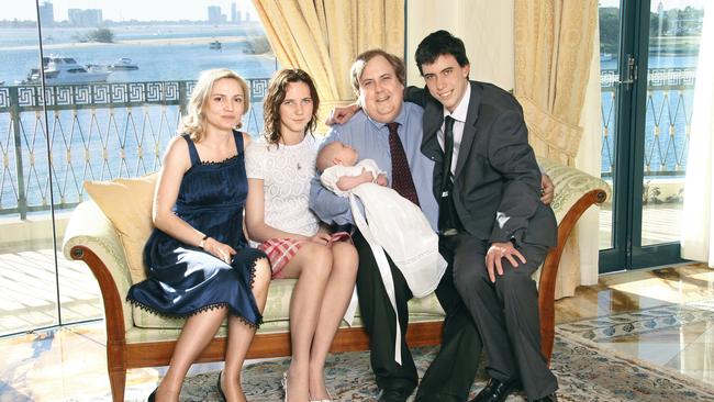 An old family snap of Clive Palmer, his then baby daughter Mary with wife Anna, and his children Emily and Michael.