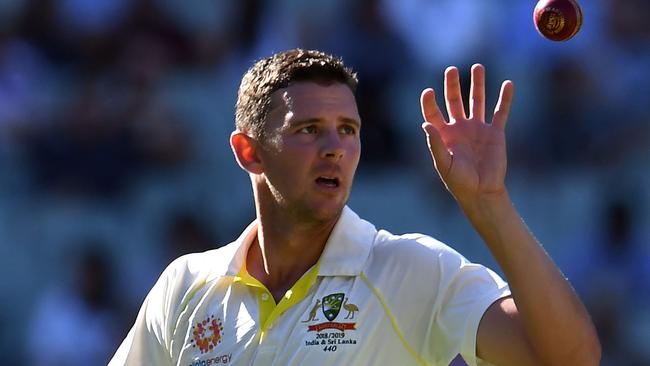 (FILES) In this file photo taken on December 26, 2018, Australia's paceman Josh Hazlewood prepares to bowl during day one of the third cricket Test match between Australia and India in Melbourne. - Australia suffered a big blow on January 19, 2019 with star fast bowler Josh Hazlewood ruled out of their two upcoming Tests against Sri Lanka with a back injury, and Jhye Richardson replacing him. (Photo by WILLIAM WEST / AFP) / -- IMAGE RESTRICTED TO EDITORIAL USE - STRICTLY NO COMMERCIAL USE --