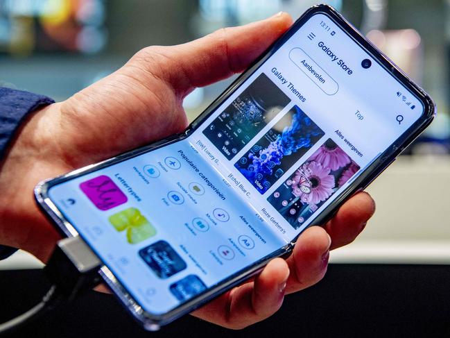 This picture taken on February 21, 2020  shows the new Galaxy Galaxy Z Flip mobile phone in the Samsung Experience flagship store in Utrecht, The Netherlands. (Photo by Robin UTRECHT / ANP / AFP) / Netherlands OUT - Belgium OUT