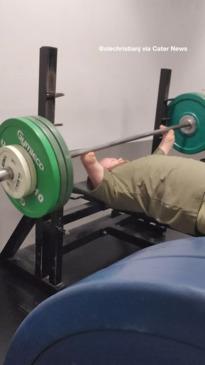 Gym enthusiast does his workout with no hands