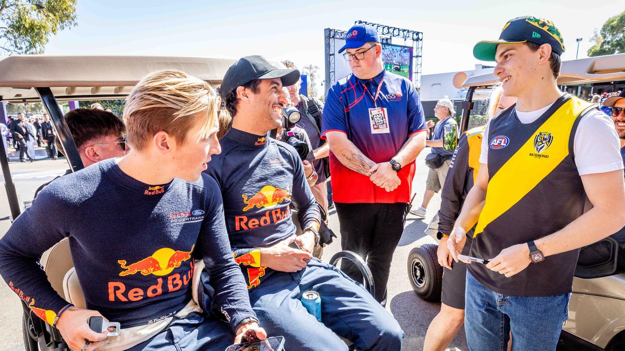 Liam Lawson, Daniel Ricciardo and Oscar Piastri chat at the 2024 Australian F1 Grand Prix in Melbourne. Picture: Jake Nowakowski