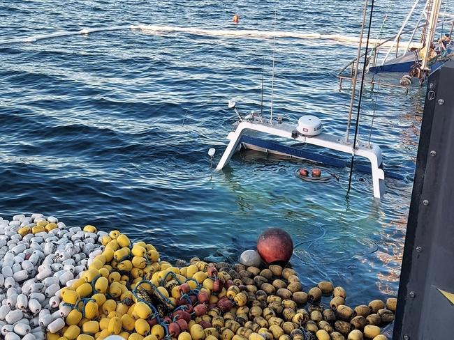 Fire and Rescue NSW crews assisted in the recovery of a fishing trawler at Eden on the state's south coast, carrying 50-tonnes of salmon, began taking on water at the port around 3.30 this morning. Picture: FRNSW