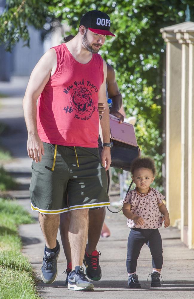 Alexis Ohanian and daughter Alexia Olympia, 1, make their way down the footpath. Picture: Media Mode