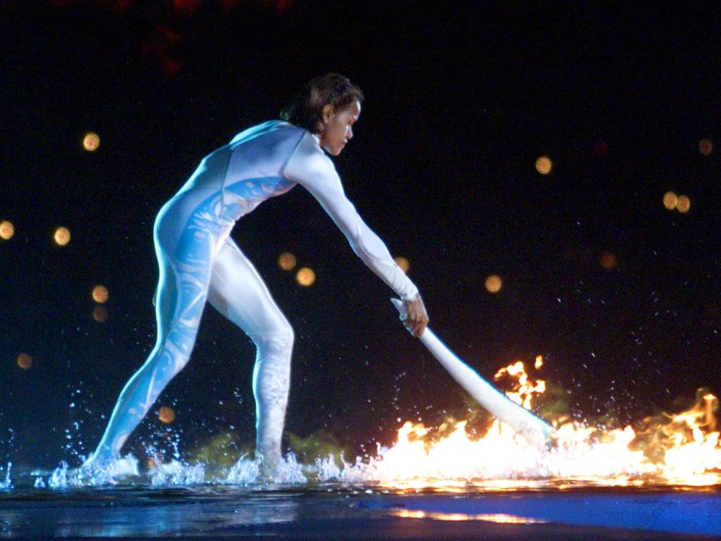 Cathy Freeman ignites the Olympic flame during the opening ceremony for Sydney 2000 games. Picture: AP