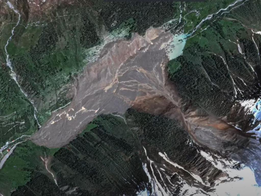 Recent satellite images show the town engulfed by debris and mud. Picture: Storyful